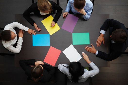 business people with colored paper concept