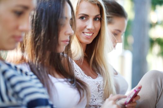 group of young women relaxing at the park