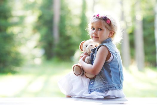 portrait of young girl with teddybear