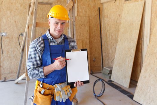 portrait of foreman pointing at white folder plate