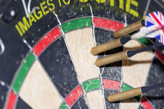 four darts in the bed of a dartboard