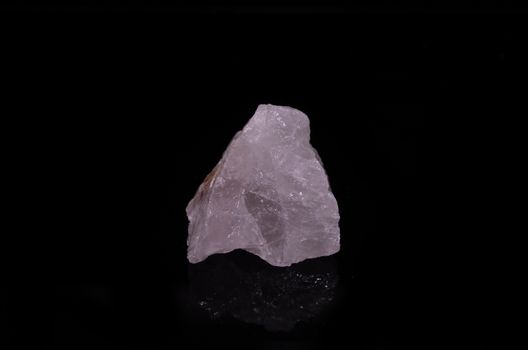 Sample of a beautiful Rose Quartz nature specimen isolated on black background