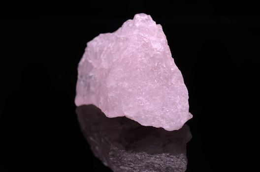 Sample of a beautiful Rose Quartz nature specimen isolated on black background