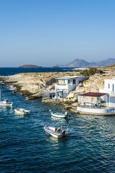 Traditional fishing village with fishing boats on Milos island at Greece