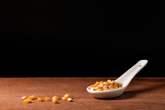 Maize threads on a white porcelain spoon