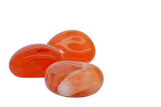 Set of a beautiful tumbled carnelian semiprecious stones isolated on white