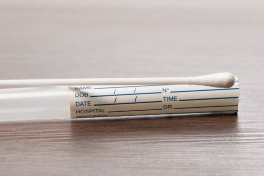 DNA test tube and cotton swab, wipe test