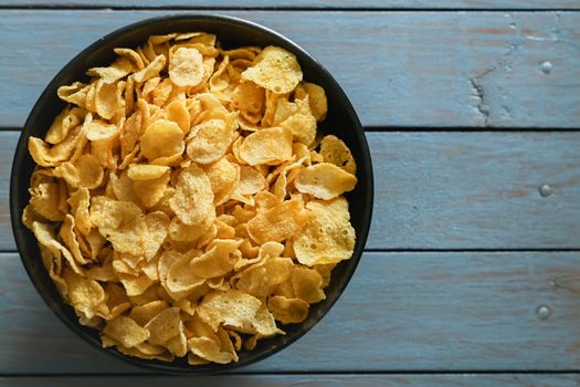cornflakes on wooden table background