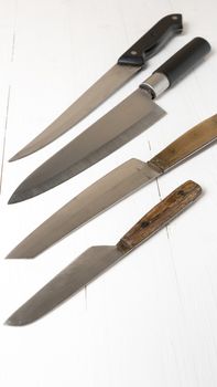 kitchen knife over white table background