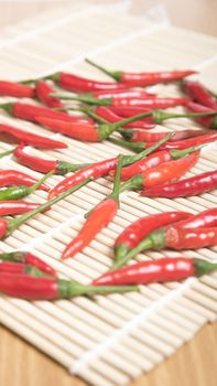 red chili peppers on wood table background