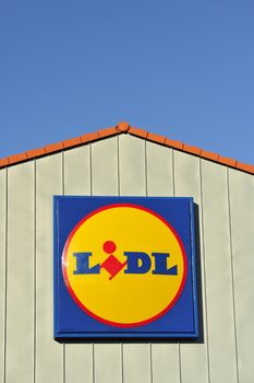 STOCKHOLM - MAY 1 2013: A Lidl sign on the roof of a gas station on may 1th 2013 in Stockholm, Sweden. Lidl, a German supermarket chain which has only discount stores.