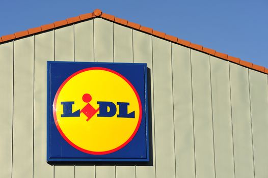 STOCKHOLM - MAY 1 2013: A Lidl sign on the roof of a gas station on may 1th 2013 in Stockholm, Sweden. Lidl, a German supermarket chain which has only discount stores.