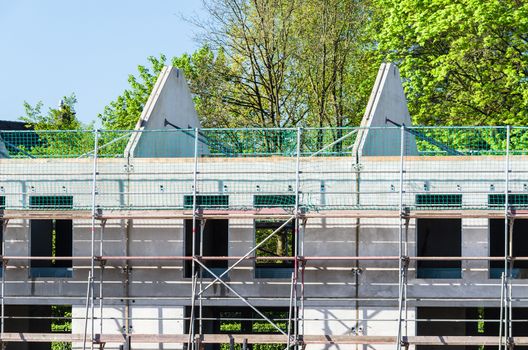 Prefabricated house construction of terraced houses. Here, from pre-made stone plate.