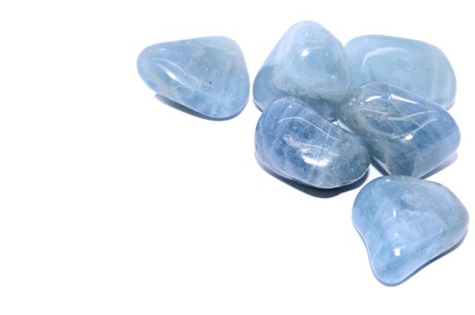 Set of a beautiful tumbled Aquamarine semiprecious stones isolated on white