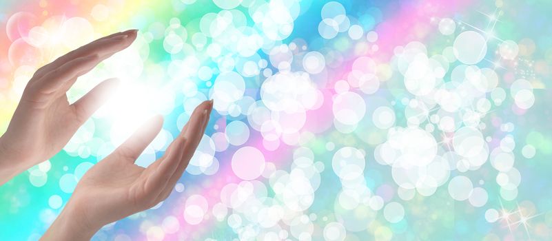 Healing Hands on a sparkling pastel coloured background