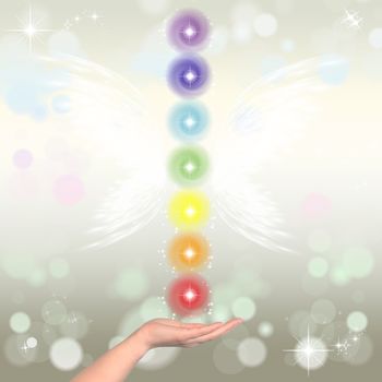 Healing Hand and seven chakras on a sparkling pastel coloured background