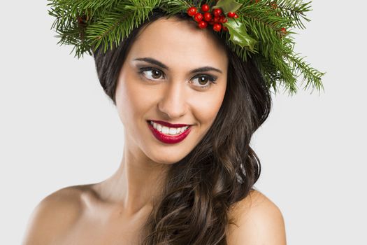 Portrait of a beautiful woman with Cristmas decorations on the head