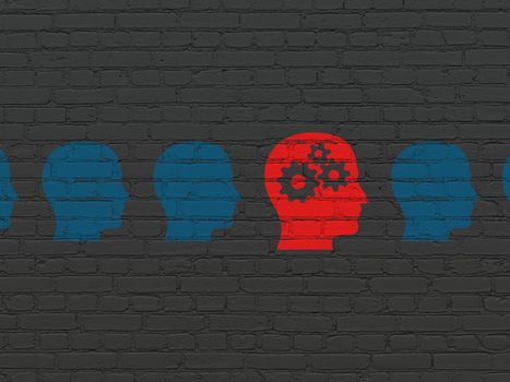 Education concept: row of Painted blue head icons around red head with gears icon on Black Brick wall background