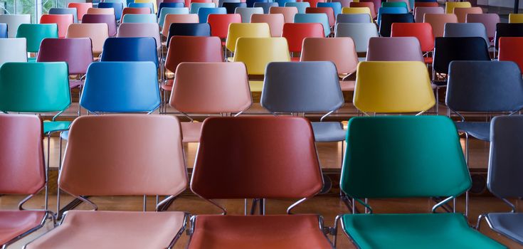 Rows of colorful chairs in Auditorium