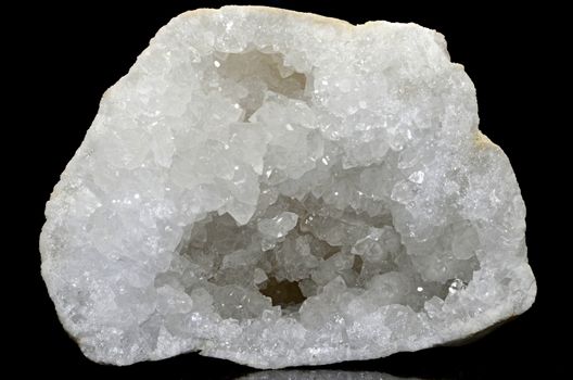 Sample of  Clear Quartz Geode a beautiful nature specimen isolated on black background