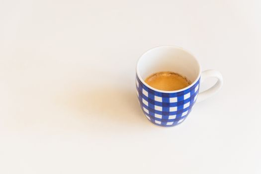 a blue striped cup of coffee