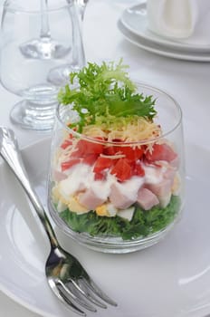 Salad of lettuce with egg, ham, tomatoes, dressed   yogurt and cheese