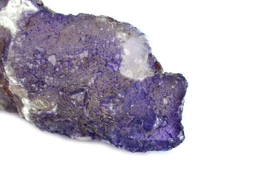 Sample of a deep violet Fluorite nature specimen isolated on white background