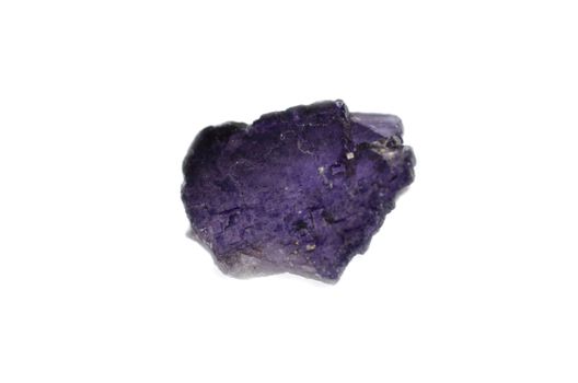 Sample of a deep violet Fluorite nature specimen isolated on white background