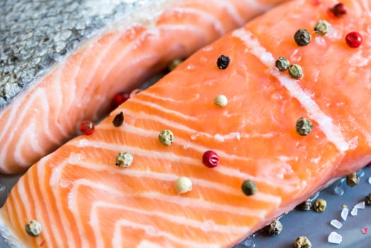 Detail of Fresh Raw Salmon Fillet with Peppers