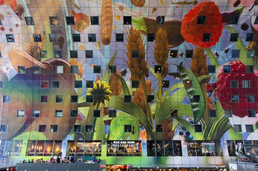 Rotterdam, Netherlands - May 9, 2015: People shopping at Markthal (Market hall) a new icon in Rotterdam. The covered food market and housing development shaped like a giant arch by Dutch architects MVRDV.
