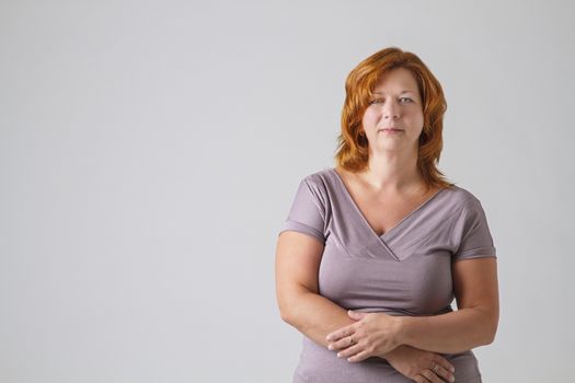 red hair woman, wearing a gray shirt