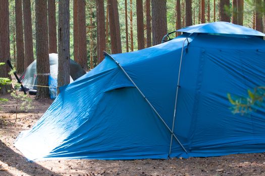 camping with a tent in the woods different options