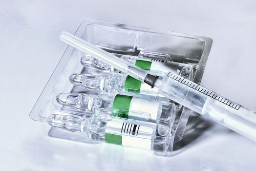 plastic medical syringe and ampoule with needle  before make drug injection