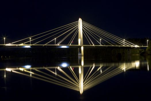 Cable Bridge in Umeå, Sweden. The "Kolbäcksbron" with the river Umeälv in front.