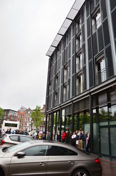 Amsterdam, Netherlands - May 16, 2015: Tourists stand in a queue to Anne Frank House Museum on May 16, 2015. The Anne Frank House Museum is one of Amsterdam's most popular museums opened in 1960.