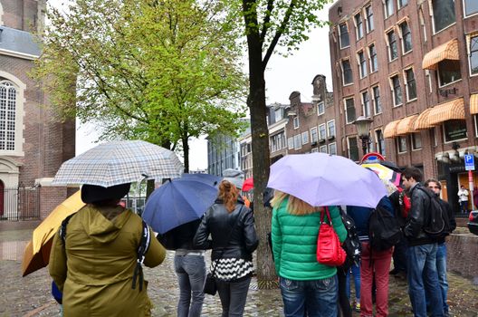 Amsterdam, Netherlands - May 16, 2015: People queuing at the Anne Frank house and holocaust museum in Amsterdam, Netherlands, on May 16, 2015. Anne Frank house is a popular tourist destination.