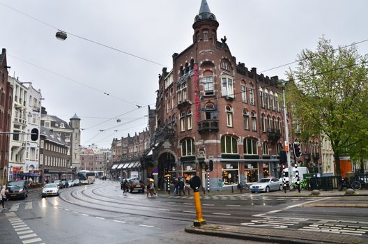 Amsterdam, Netherlands - May 16, 2015: People at Westermarkt District in Amsterdam on May 16, 2015. Amsterdam is the capital and most populous city of the Netherlands.