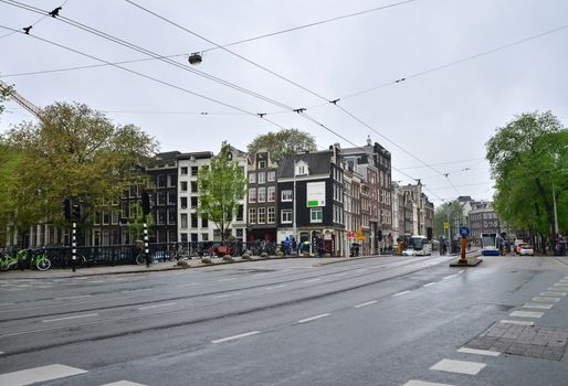 Amsterdam, Netherlands - May 16, 2015: People at Westermarkt District in Amsterdam on May 16, 2015. Amsterdam is the capital and most populous city of the Netherlands.