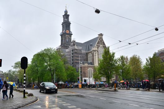 Amsterdam, Netherlands - May 6, 2015: People visit Westerkerk (Western Church) a Dutch Protestant church in central Amsterdam in the Netherlands. on May 6, 2015.