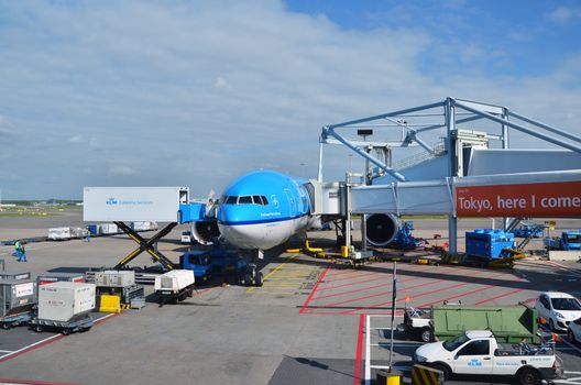 Amsterdam, Netherlands - May 16, 2015: KLM Plane at Schiphol Airport on May 16, 2015 in Amsterdam, Netherlands. The airport handles over 45 million passengers per year with almost 100 airlines flying from here.