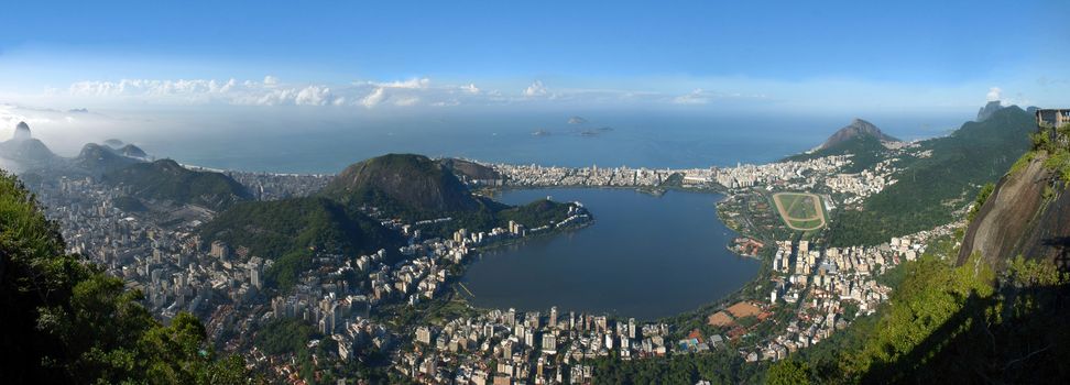 Panoramic view of Rio De Janeiro, sky, city and seashore view from Christ the Redeemer. Brazil landscape.