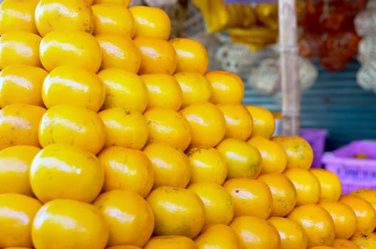 Fresh Oranges background,Orange honeysuckle species, stack on the market for sale.