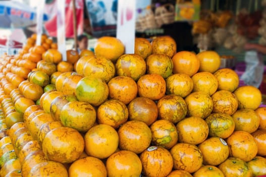 Fresh Oranges background,Orange honeysuckle species, stack on the market for sale.