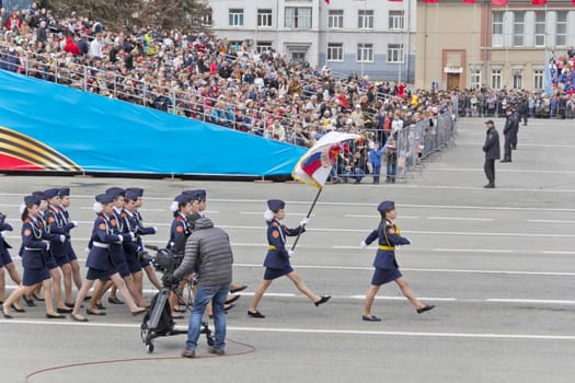 Samara, Russia - May 9: Russian woman midshipmans march at the parade on annual Victory Day, May, 9, 2015 in Samara, Russia.