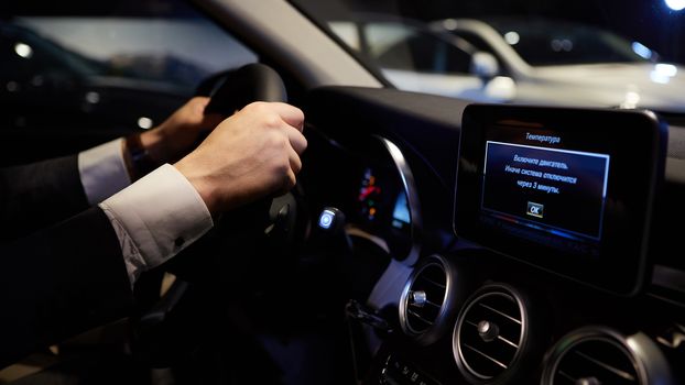 Closeup of hands on a steering wheel