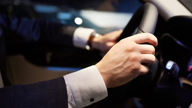 Closeup of hands on a steering wheel