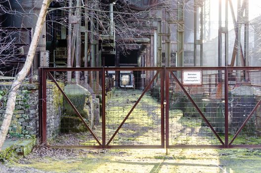 Exterior of the entrance of an old factory building.