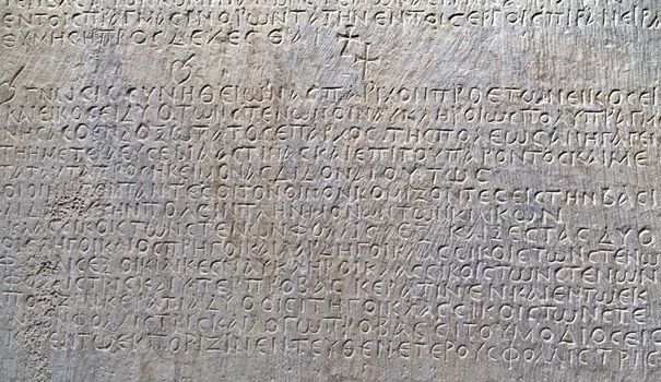 Ancient greek text carved on marble, close-up