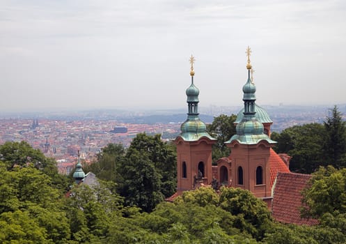 Saint Nicholas church and rooftops in Prague, Czech Republic