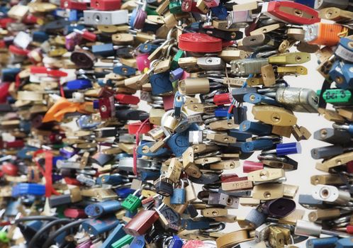 Wedding locks on the rail of a bridge